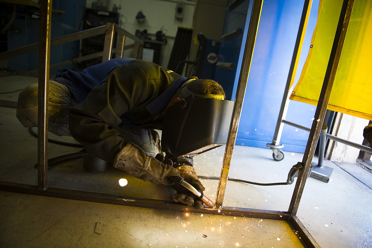 Welder at work with sparks flying