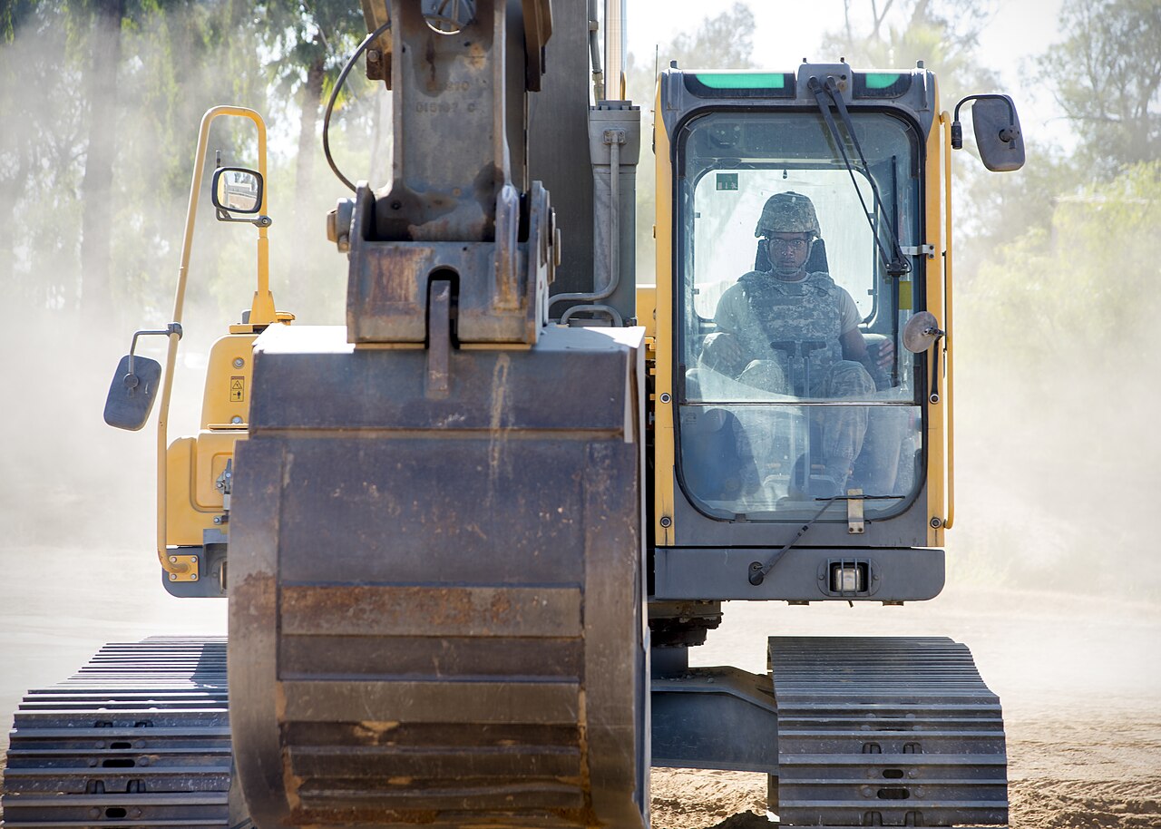 Excavator working on an underground pipe job